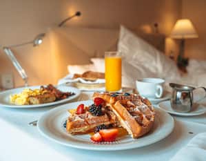 Room Service Breakfast with waffles and orange juice