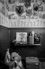 Luggage in room with table and flask