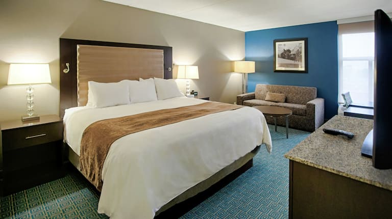 King Guest Room with Sleeper Sofa, work desk and outside views