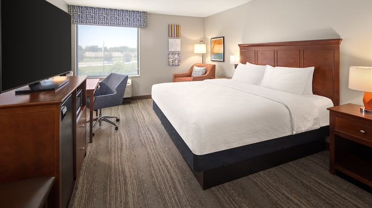 bed, tv, and workdesk