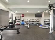 Convenient on-site fitness center fully equipped with free weights and cardio machines.