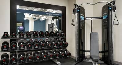 Convenient on-site fitness center fully equipped with free weights and exercise machines.