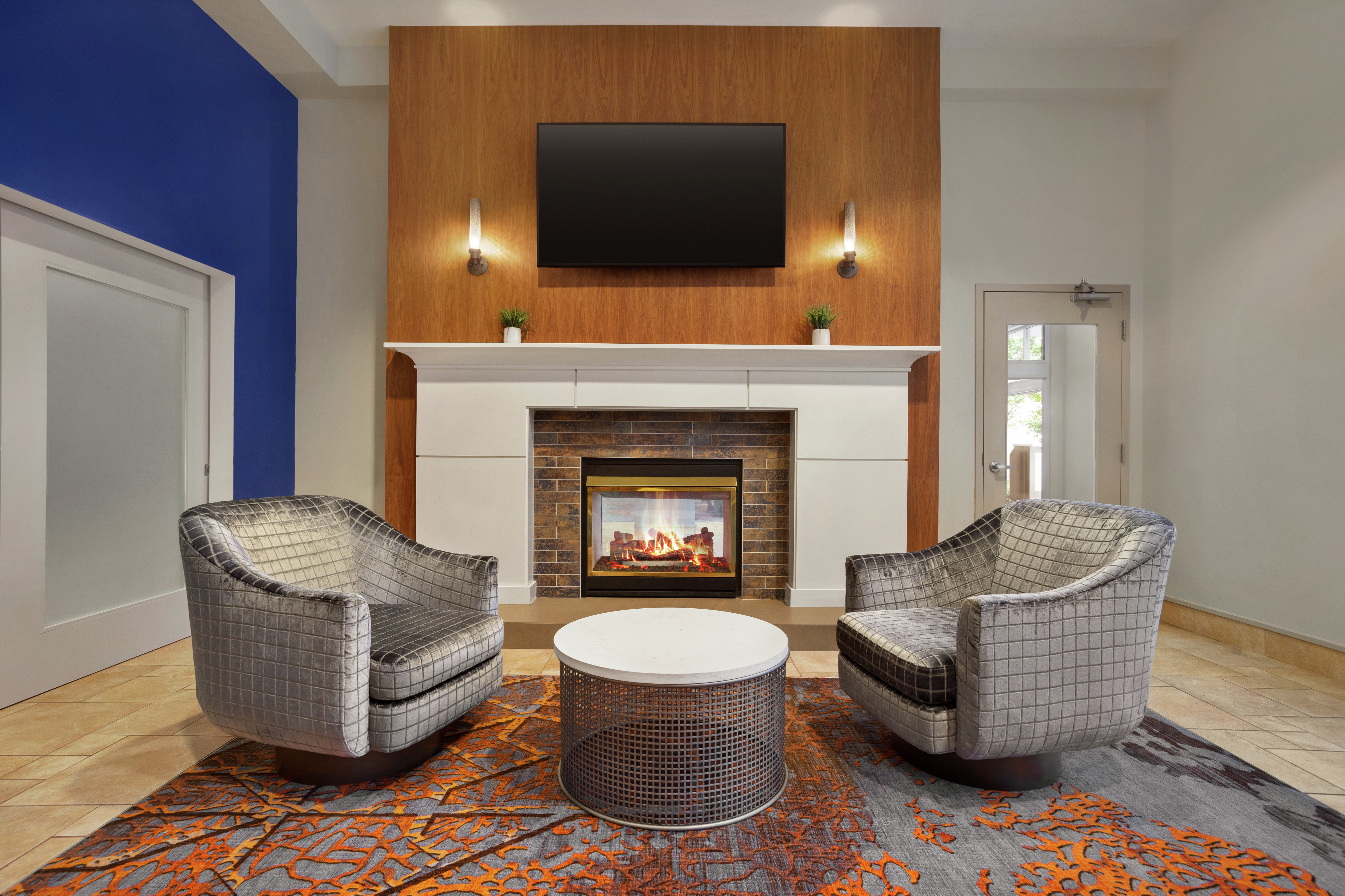 Lounge Seating Area with Fireplace and Television