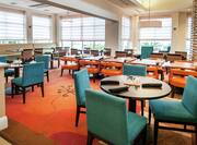 Hilton Garden Inn Dining Area with Tables and Chairs