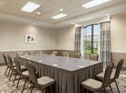 Bright on-site meeting room featuring large boardroom table.