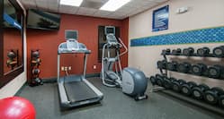 Fitness Center with Mirror, Room Technology, Treadmill, Elliptical, and Weights
