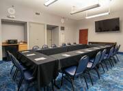 Meeting Room with Tables, Chairs, and Room Technology