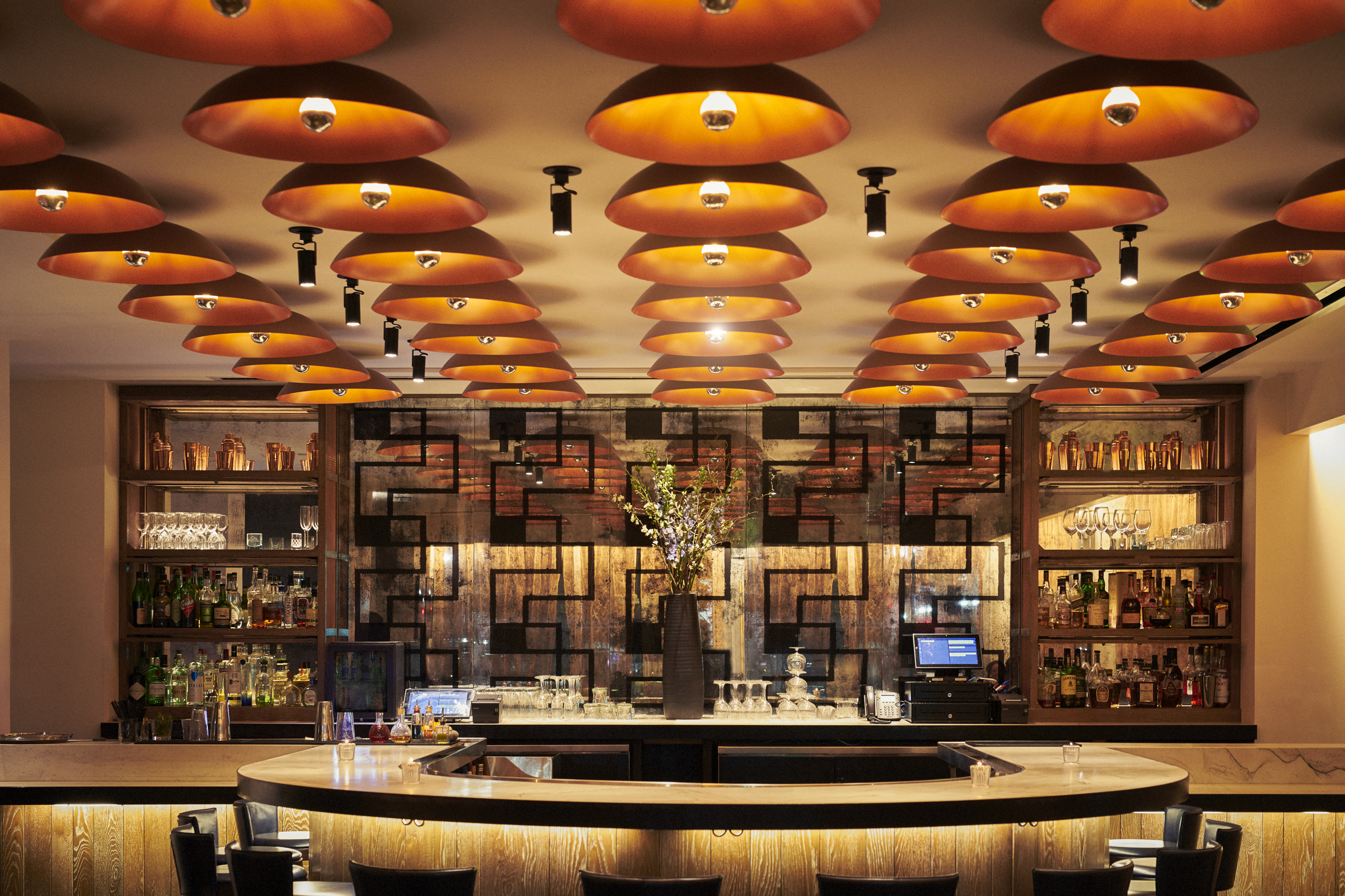  Jayne Restaurant Circular Bar with High Chairs and Golden Lighting