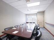 Meeting Room with Table and Armchairs