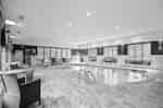 indoor pool, lounge chairs, tables