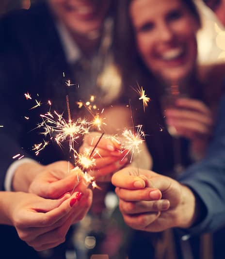 Party goers with sparklers
