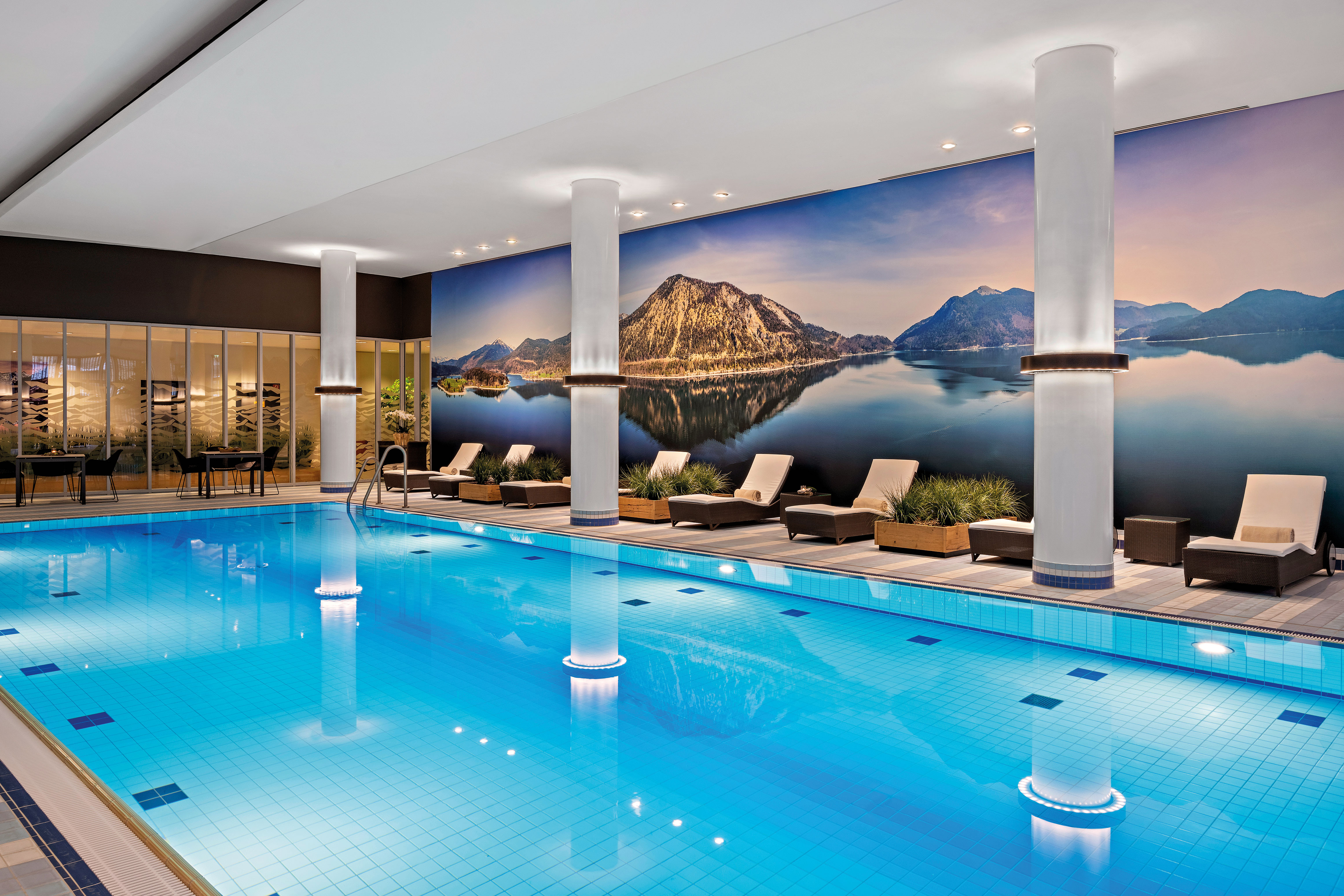 Indoor Pool with Seating Area and Beautiful Wall Decoration