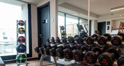 Fitness center with free weights and mats