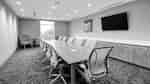 Media Room With Conference Table and TV