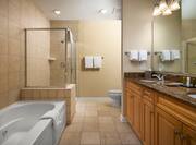 Dual Vanity Area Bathtub and Separate Shower in Hotel Guest Room
