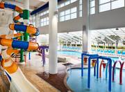Indoor Pool Area With A Water Slide