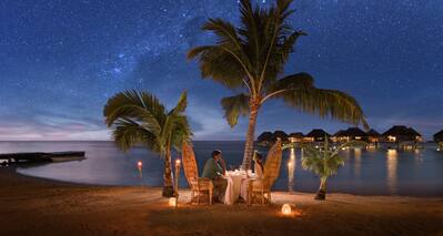 Couple Having a Romantic Dinner on Private Beach at 
