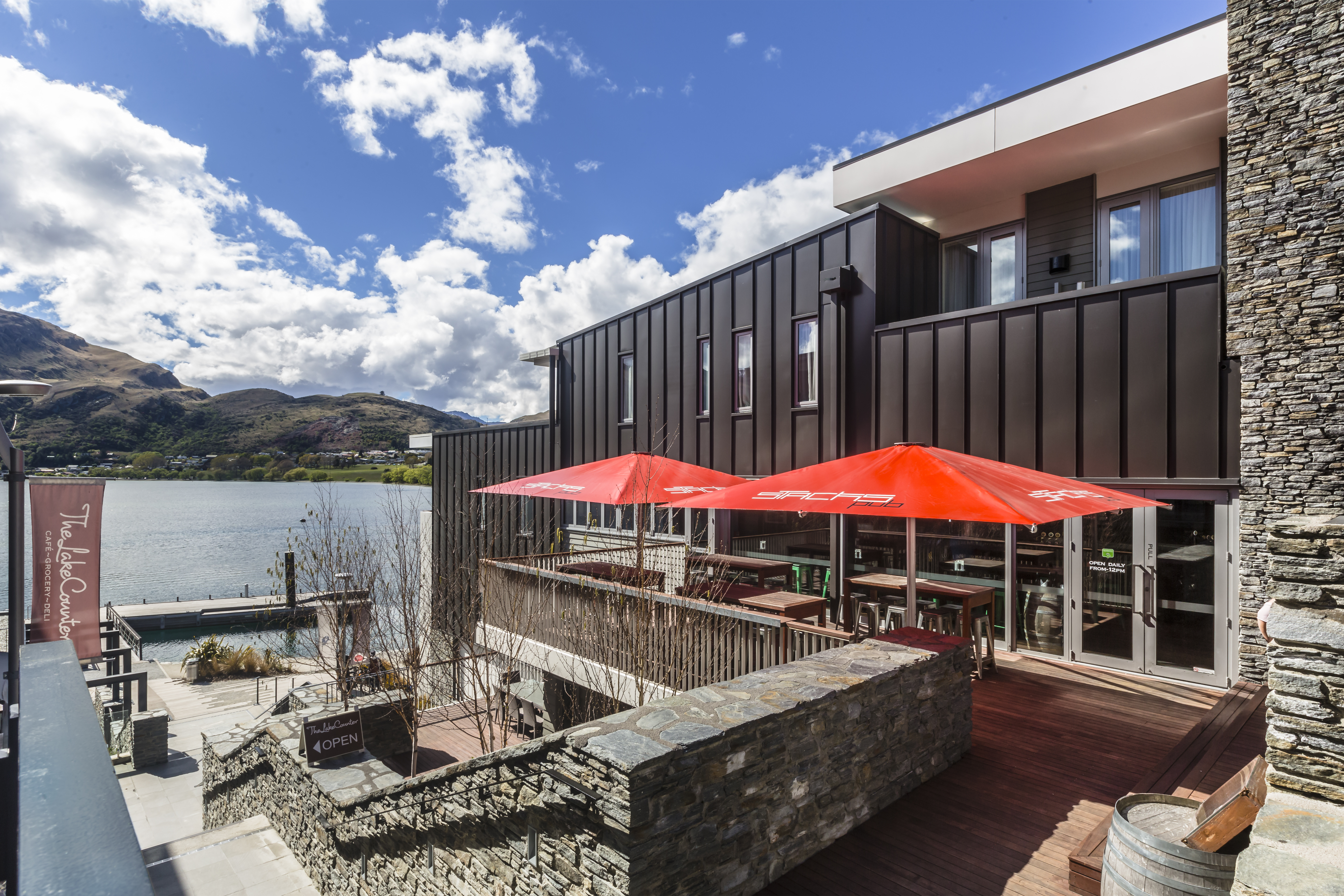 Hotel Exterior and Pub Deck with Sea and Mountain Views