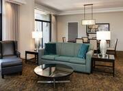 Soft seating and lamps in a presidential suite