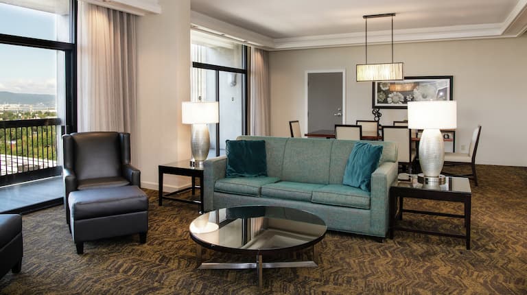 Soft seating and lamps in a presidential suite