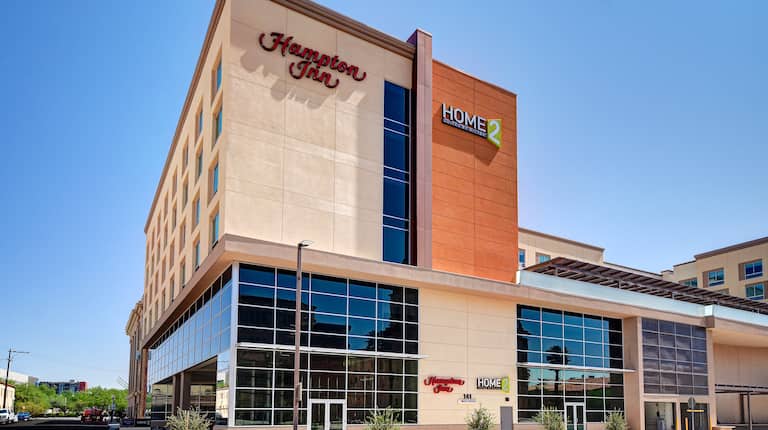 exterior front of hotel in the day