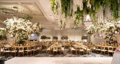 Weddings, ballroom reception tables and hanging flowers