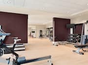 Fitness Center with Rowing Machine, Treadmills, Dumbbell Rack and Weight Bench