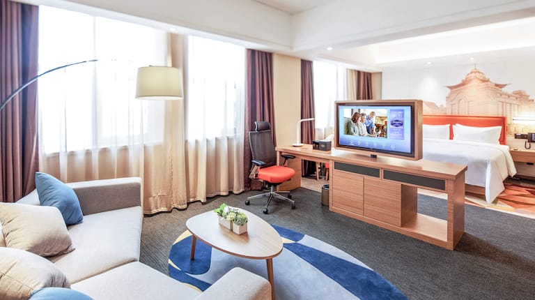 Suite with King Bed, Work Desk, TV, and Lounge Area