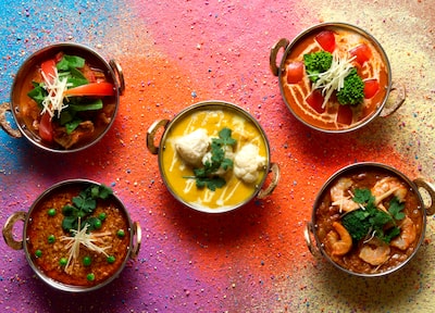 Five small bowls of curry