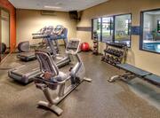 Fitness Center with Weights Treadmill and Recumbent Bike