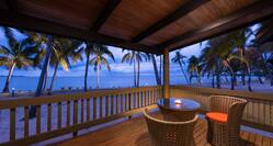 Seating for Two at Candlelit Table on Private Balcony With Ocean View