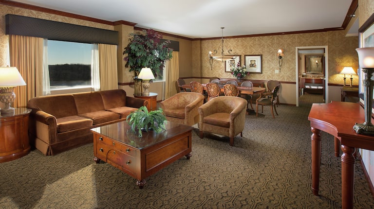Suite Living Area with Couch, Armchairs, Table, Chairs, Room Technology, and Outside View