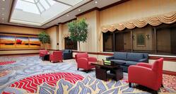 DoubleTree Hotel Prefunction Area with Armchairs, Tables, and Couches