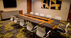 Meeting Room with U-Shape Table Layout and Wall Mounted HDTV