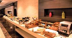 Counter at Atrium Brasserie with breads and food selections