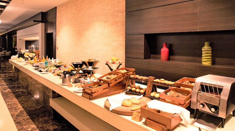 Counter at Atrium Brasserie with breads and food selections