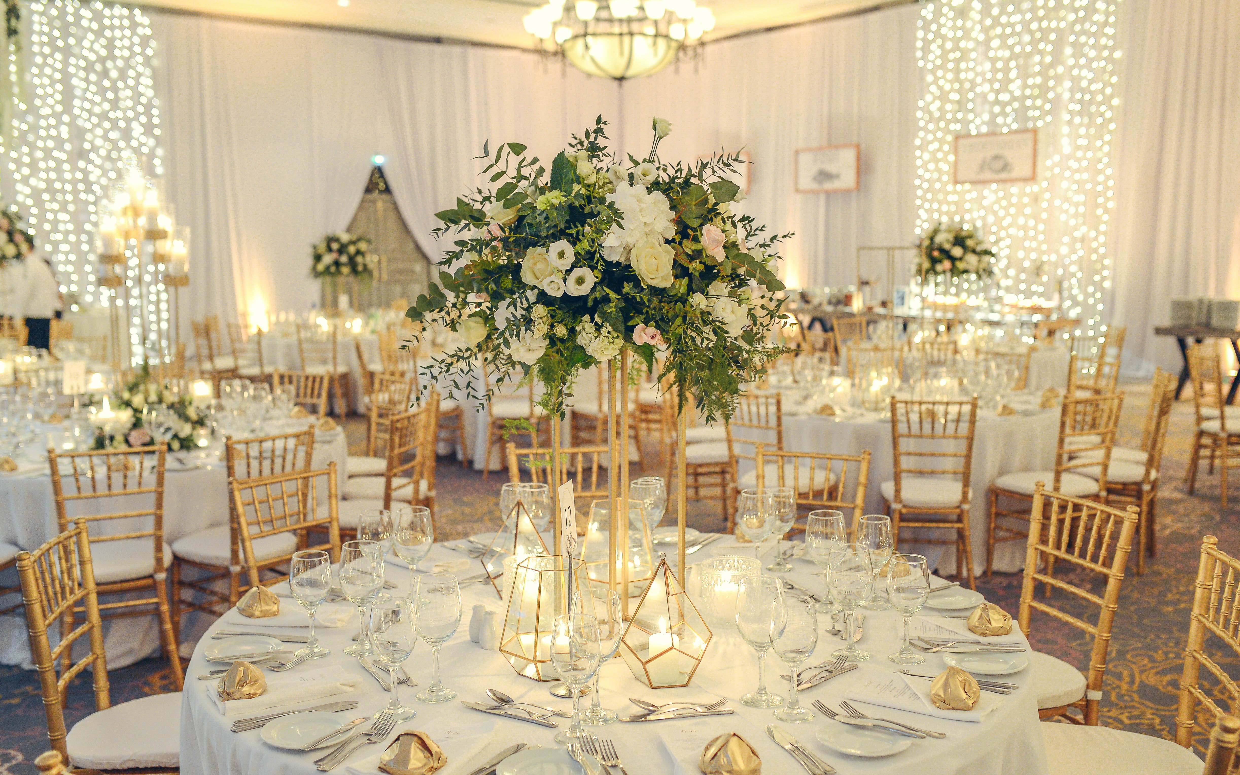 Event Setup with Table and Chairs and Flower Central Piece