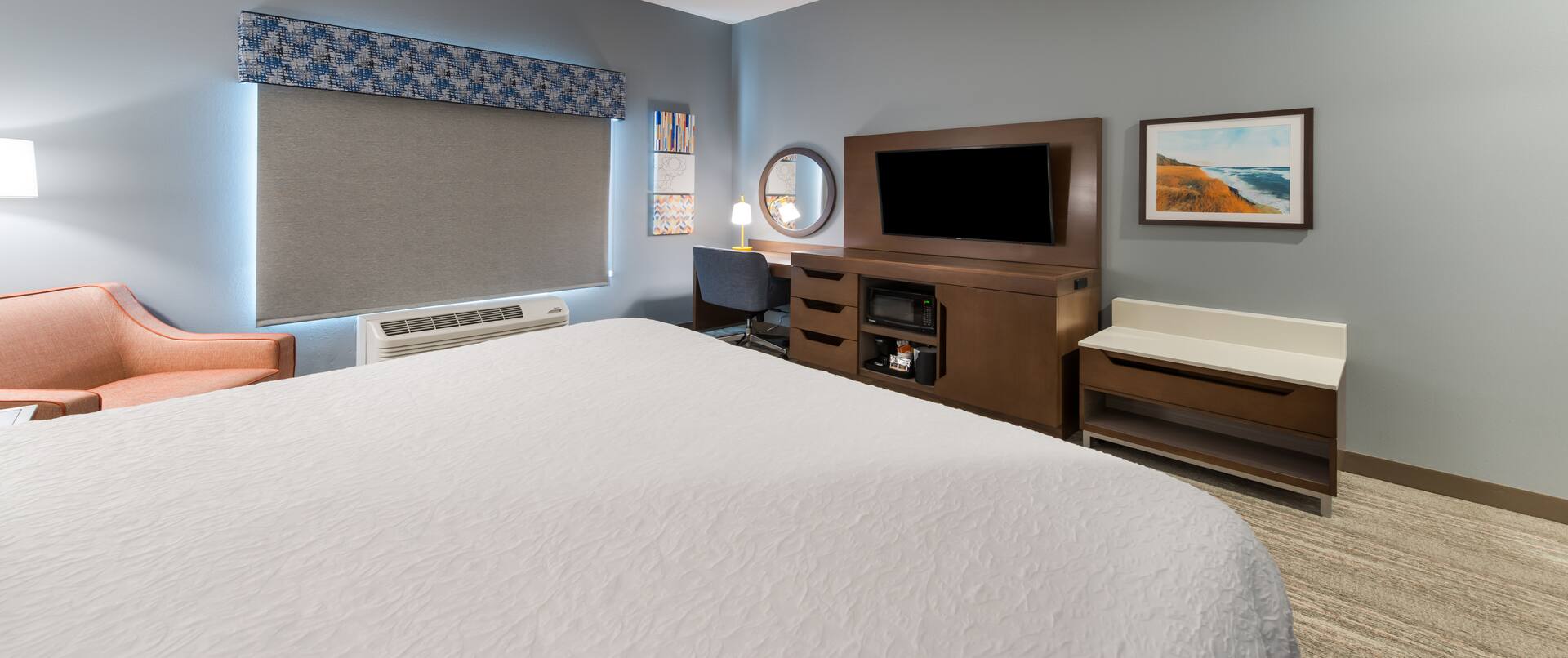 HDTV Desk and Large Bed in Hotel Guest Room