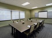 Cypress Room in Boardroom Setup With Seating for 8 Facing Whiteboard