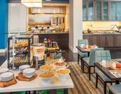 Breakfast Buffet with Hot and Cold Selections and View of Seating at Garden Grille and Bar