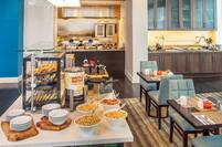 Breakfast Buffet with Hot and Cold Selections and View of Seating at Garden Grille and Bar