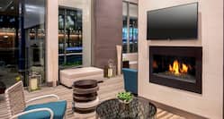 Lobby Seating by Fireplace and HDTV with Outside View