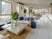 Sandbar Rooftop with Large Windows Offering City View