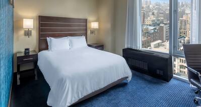 Large Bed in Guest Room with City View