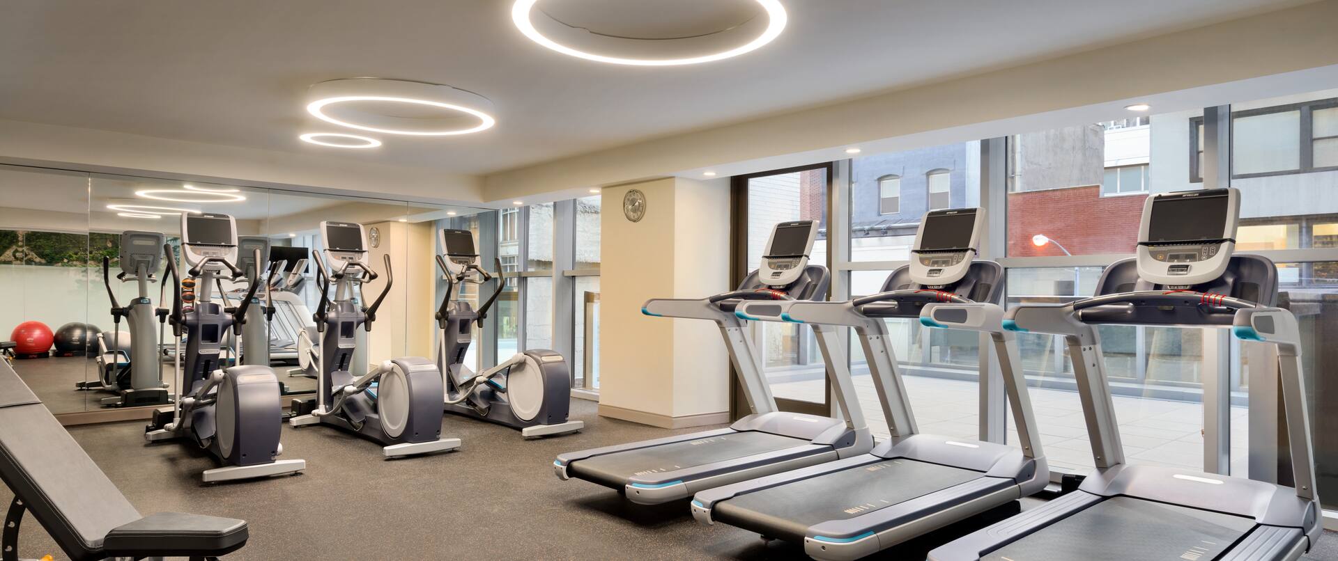 Fitness Center with Treadmills, Cross-Trainers and Weight Bench