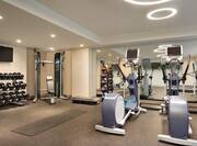 Fitness Center with Cross-Trainers, Weight Machine, Dumbbell Rack and Wall Mounted HDTV