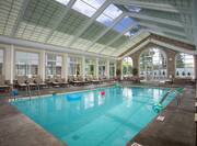 Loungers, Tables and Chairs by Atrium Indoor Pool and Hot Tub