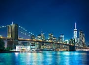 Illuminated Brooklyn Bridge and New York Skyline at Night