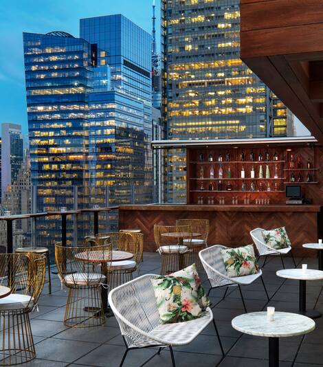 Hotel Rooftop Patio with City Skyline View