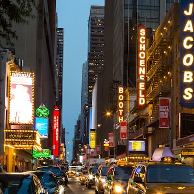 New York Broadway street sign with neon signs